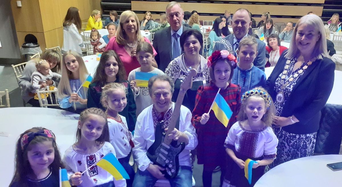 Ukrainian children with guitarist Val prepare to entertain 